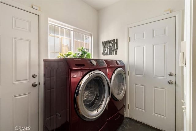 washroom featuring laundry area and washing machine and dryer