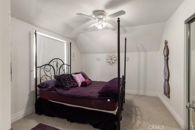 bedroom featuring carpet, baseboards, vaulted ceiling, and a ceiling fan