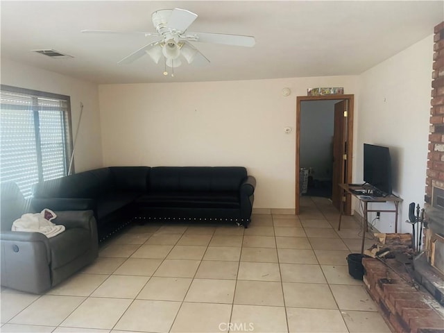 tiled living room featuring ceiling fan