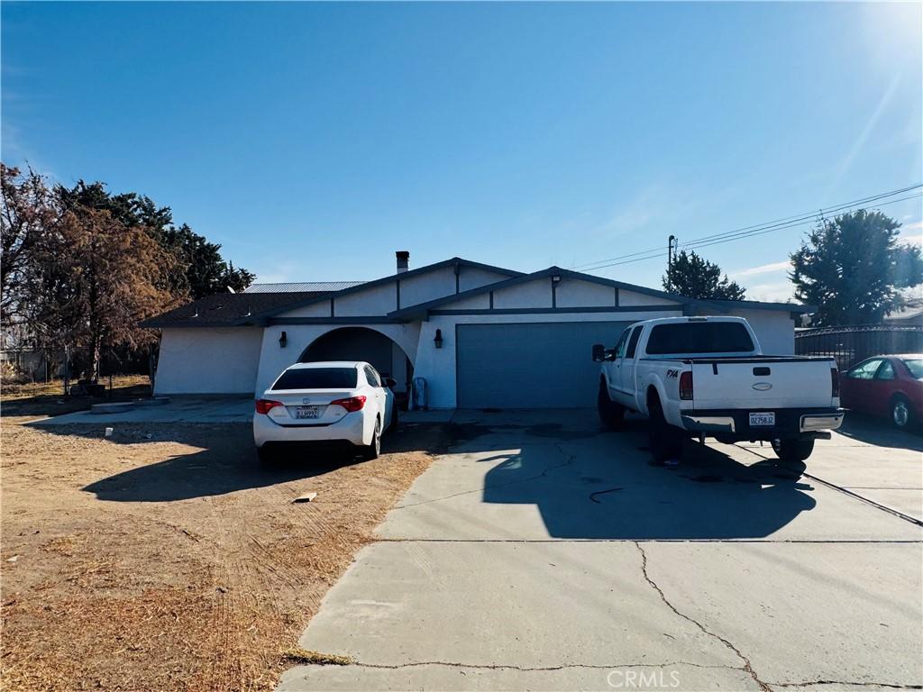 ranch-style home featuring a garage