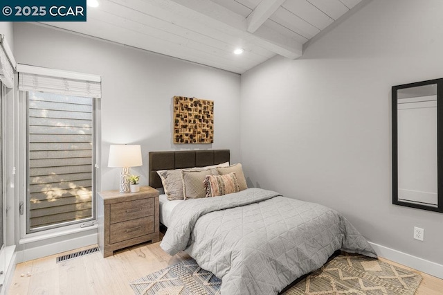 bedroom featuring vaulted ceiling with beams, wooden ceiling, and light wood-type flooring