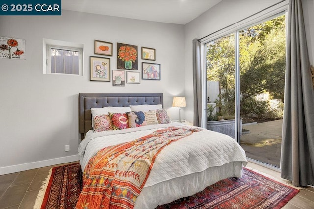 bedroom with access to exterior and tile patterned flooring