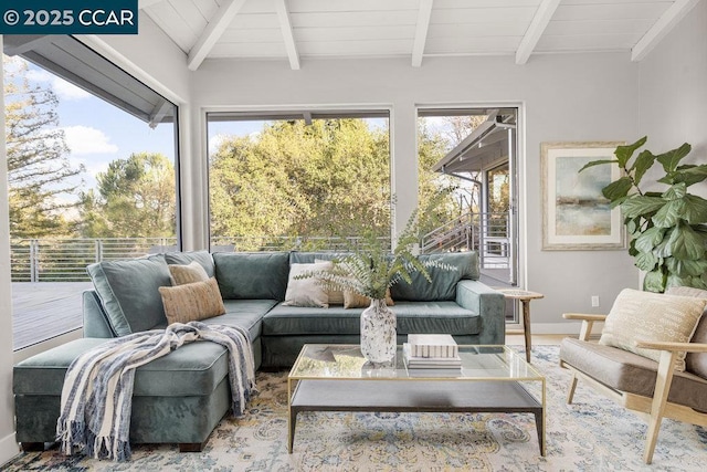 sunroom / solarium with a wealth of natural light, lofted ceiling with beams, and wooden ceiling