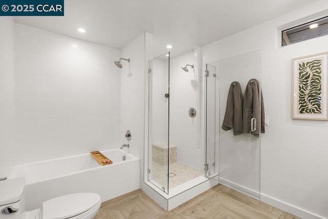 bathroom featuring parquet flooring, toilet, and shower with separate bathtub