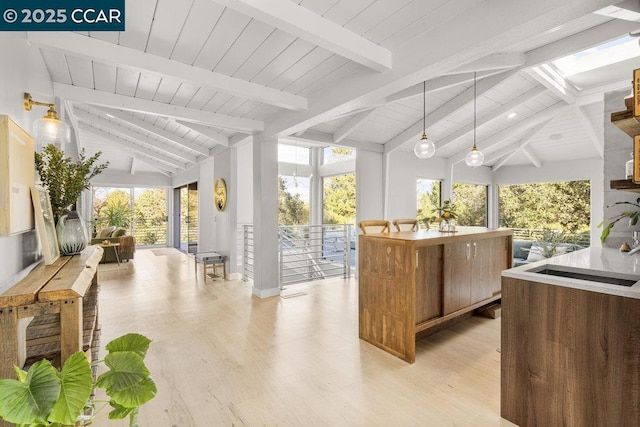 interior space with vaulted ceiling with beams and wooden ceiling