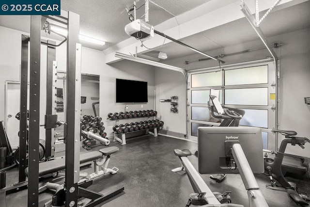 exercise room with a textured ceiling