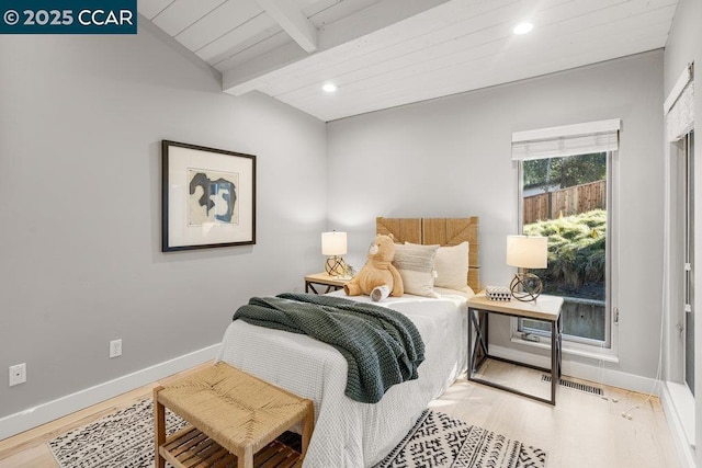 bedroom featuring wood ceiling, wood-type flooring, and lofted ceiling with beams