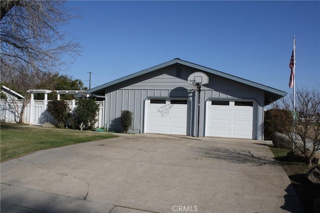 garage featuring a lawn