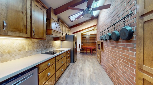 kitchen with dishwashing machine, beamed ceiling, light wood-style floors, stainless steel refrigerator with ice dispenser, and black electric stovetop