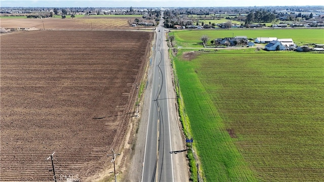 birds eye view of property with a rural view