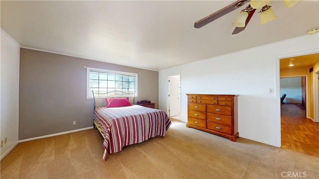 carpeted bedroom with baseboards and ceiling fan