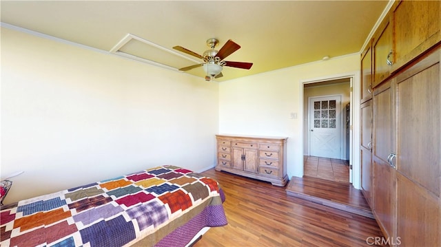 bedroom with ceiling fan and wood finished floors