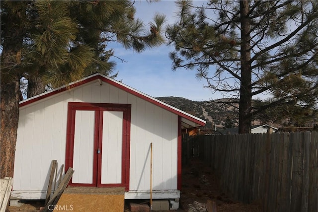 view of outbuilding featuring a mountain view