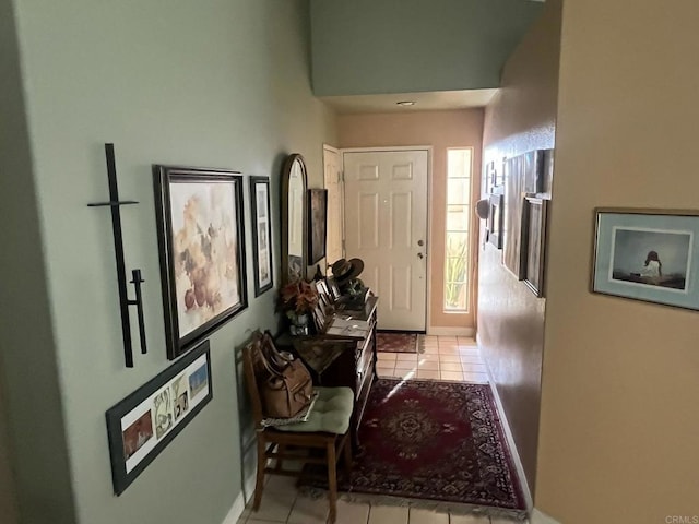 hall with light tile patterned flooring