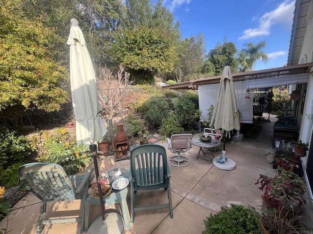 view of patio featuring an outdoor fireplace