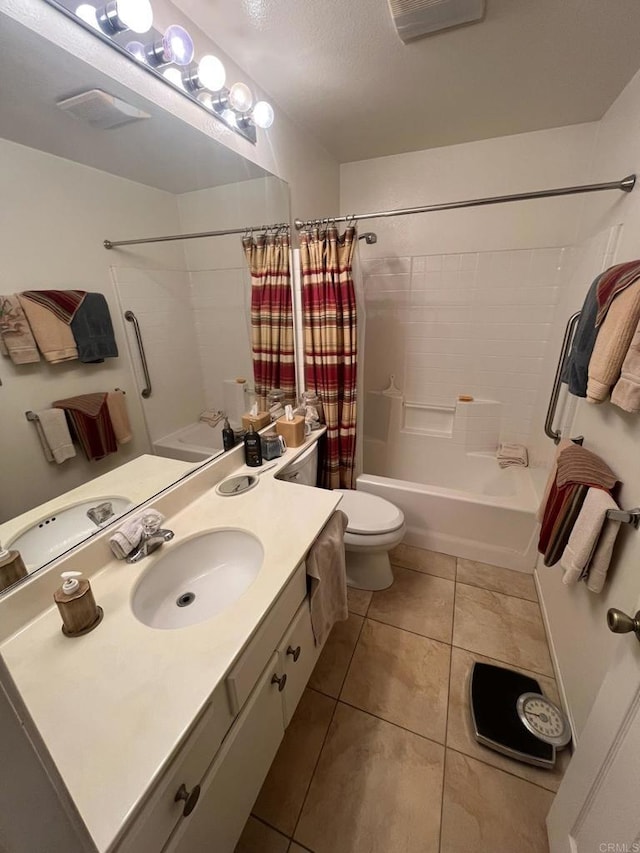 full bathroom featuring shower / tub combo with curtain, vanity, tile patterned floors, and toilet