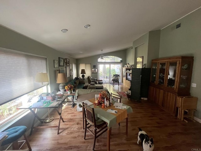 dining room featuring lofted ceiling and hardwood / wood-style flooring