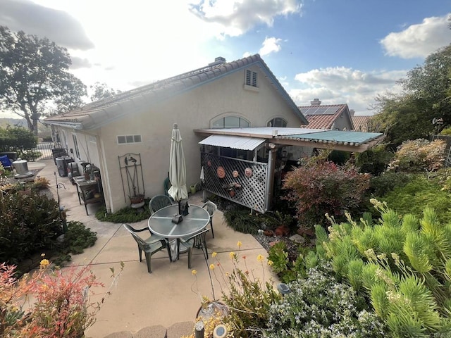 back of house with a patio area