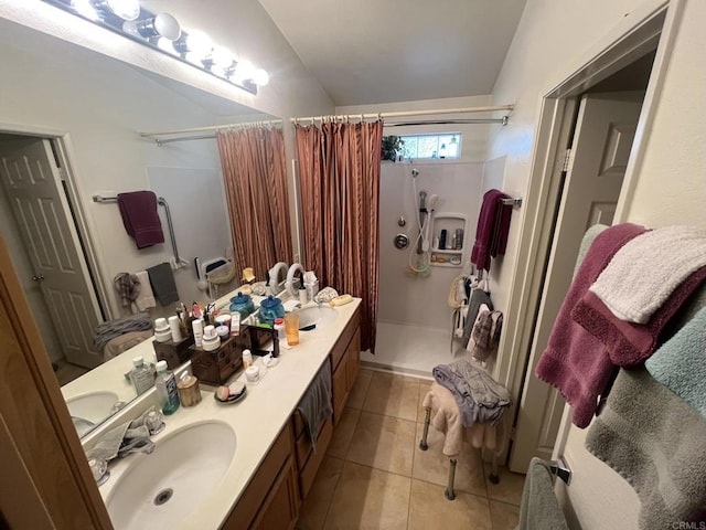 bathroom with tile patterned floors, curtained shower, and vanity