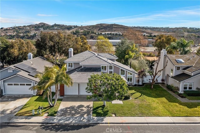 birds eye view of property featuring a mountain view