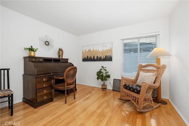 office area featuring wood finished floors and baseboards