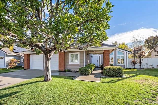 view of front of house with a garage and a front yard