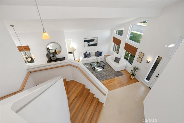 stairs featuring wood finished floors