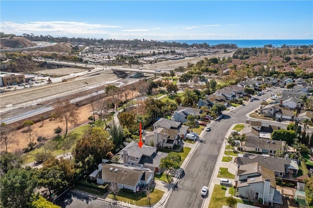 bird's eye view with a residential view and a water view