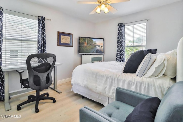 bedroom featuring ceiling fan and light hardwood / wood-style floors