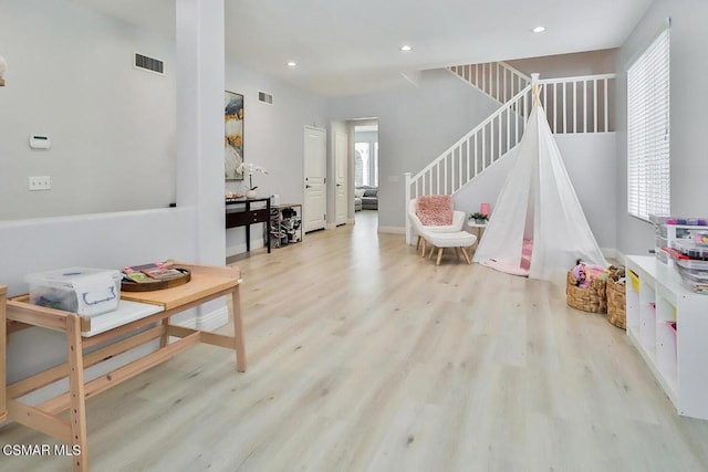 playroom with light hardwood / wood-style floors