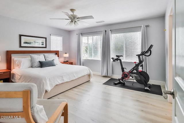 bedroom featuring ceiling fan and light hardwood / wood-style flooring