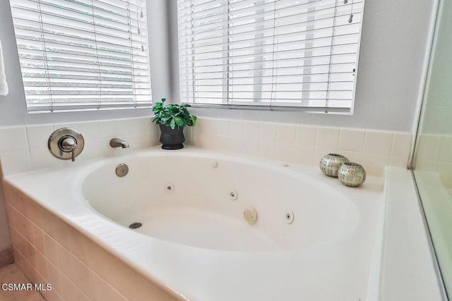 bathroom with tiled tub