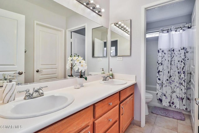 full bathroom featuring shower / tub combo with curtain, vanity, tile patterned floors, and toilet