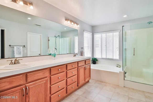 bathroom with vanity, tile patterned flooring, and separate shower and tub