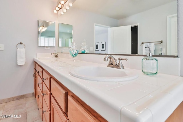 bathroom featuring tile patterned flooring and vanity