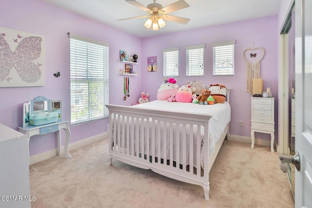 carpeted bedroom with ceiling fan