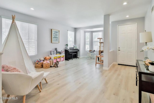 living area with light hardwood / wood-style floors