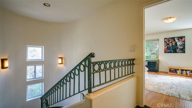 stairs with hardwood / wood-style flooring