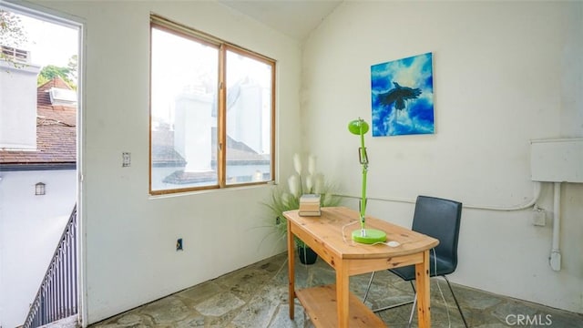 dining area with lofted ceiling and plenty of natural light