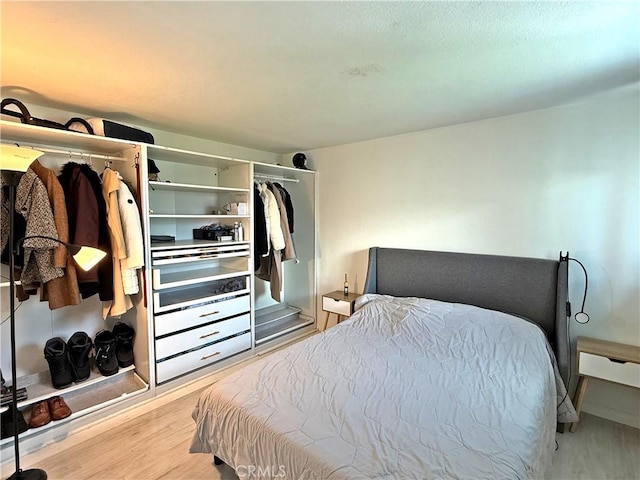 bedroom with wood finished floors