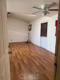 laundry area with hardwood / wood-style flooring and ceiling fan