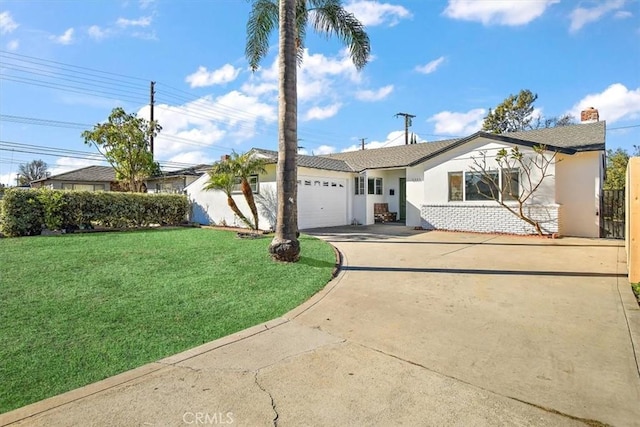 ranch-style home with a garage and a front lawn