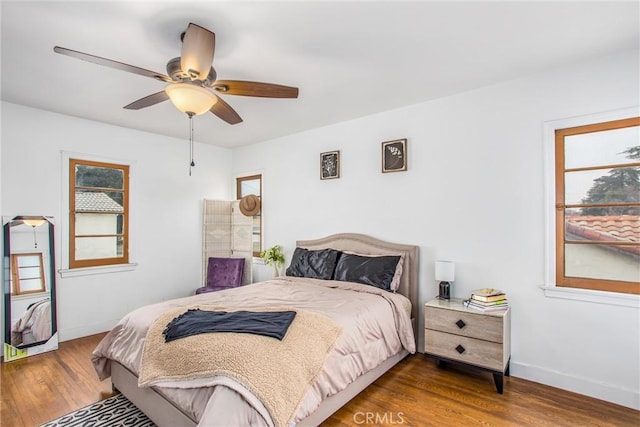 bedroom featuring hardwood / wood-style flooring and ceiling fan