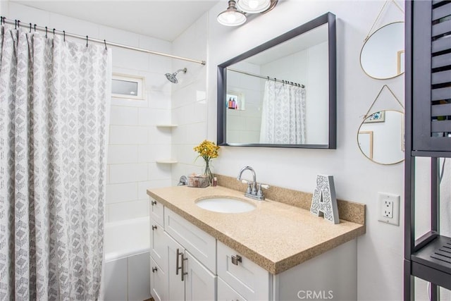 bathroom with shower / bath combo and vanity