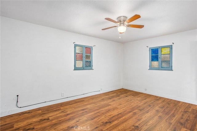 spare room featuring hardwood / wood-style flooring and ceiling fan