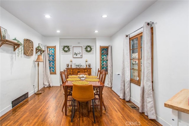 dining room with dark hardwood / wood-style floors