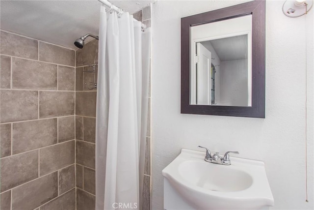 bathroom with sink and walk in shower