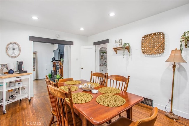 dining room with hardwood / wood-style floors