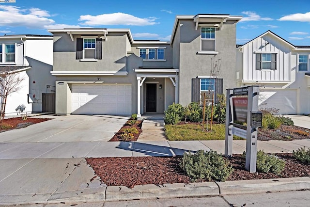 townhome / multi-family property featuring a garage