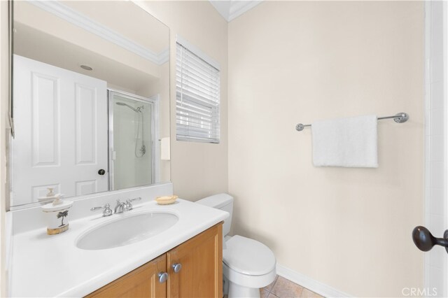 bathroom featuring tile patterned flooring, vanity, toilet, and a shower with shower door